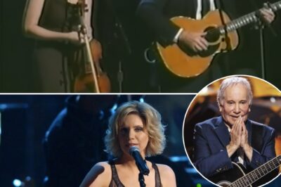 James Taylor and Alison Krauss took the stage to honor Paul Simon with a hauntingly beautiful cover of The Boxer—and what happened next was pure musical magic. Alison, with her ethereal voice, didn’t just sing; she elevated every note, every lyric, weaving a spell over the audience. James, ever the legend, stood beside her, his presence a testament to the song’s timeless soul. And Paul Simon? The man himself watched in awe, his mouth slightly agape, eyes shining like a National Guitar. In that moment, it wasn’t just a tribute—it was a masterpiece.