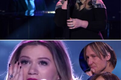 Kelly Clarkson’s voice quivered like a fragile thread stretched to its breaking point, each note soaked in raw emotion as she poured her soul into the song she penned while pregnant, yet reeling from heartbreak over her ex-husband. The air in the room grew heavy, as if the weight of her pain had settled on everyone’s shoulders. Keith Urban, unable to hold back, let tears stream freely down his face, his expression a mirror of the collective ache felt by the audience. The intensity of the moment was palpable, silencing even the smallest shuffle or whisper, leaving everyone transfixed as Kelly bared her heart in a performance that was as gut-wrenching as it was unforgettable.