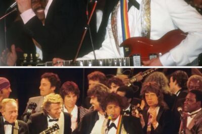 As the critic scoffed at Bob Dylan’s voice, Mick Jagger leaned forward with a smirk, his eyes flashing with defiance. “You don’t get it, do you?” he said, his voice carrying the weight of rock ‘n’ roll history. “Dylan’s voice is the music.” The room fell silent. Then, as if summoned by fate, Dylan himself appeared on stage, guitar in hand. The first raspy notes of Like a Rolling Stone filled the air, raw and electric. The crowd erupted, swept away by the magic. The critic? He sat frozen, realization dawning—he had just witnessed greatness beyond perfection.