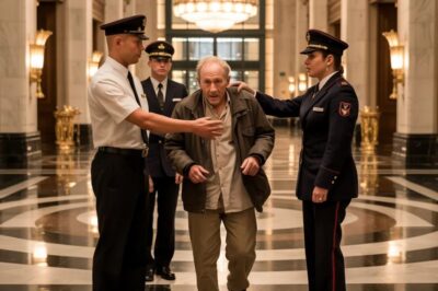 Marble floors. Crystal chandeliers. A five-star Manhattan lobby. “Sir, you can’t be in here,” the guard snaps. The old man steadies his breath and replies, “I’m here to book a room.” The manager strides over, eyes cold. “Get this homeless guy out—NOW.” Gasps ripple through the crowd as the old man calmly sets a sealed envelope on the counter and whispers, “Before you do… read that.” What’s inside will change everything—and someone’s career won’t survive the next 24 hours.