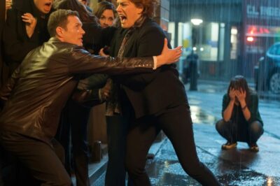 I found my daughter on her knees in the freezing rain, shaking so hard her teeth clicked—while, through the window, I heard her husband and his family laughing like it was entertainment. “Mom… please… I deserve it,” she whispered. Something in me snapped. I hoisted her up, stormed the porch, and kicked the door open. “This ends tonight,” I said. But the look on his face told me… this was only the beginning.